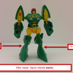 Cosmos in robot mode, standing easily. His feet have been swapped. This image also has arrows pointing to the locations of the pins to remove to swap the feet.