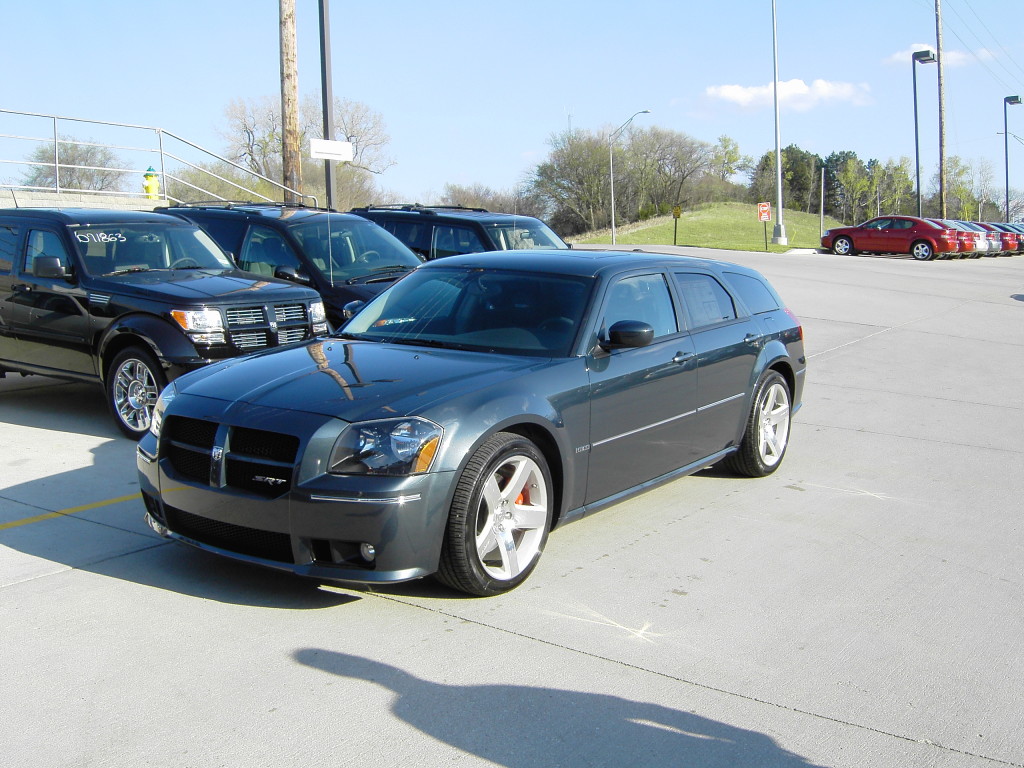 Blue Dodge Magnum SRT8 parked in dealer lot