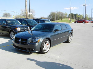 Blue Dodge Magnum SRT8 parked in dealer lot